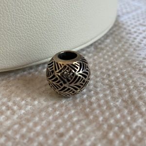 Silver Pandora charm.